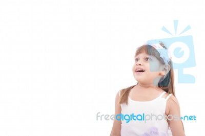 Cute Little Girl Very Surprised And Looking Up Somewhere Against… Stock Photo