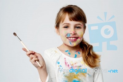 Cute Little Girl With A Painting Brush Stock Photo