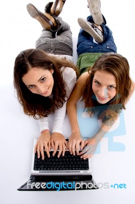 Cute Teenager Girls Busy On Laptop Stock Photo