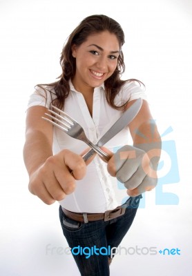 Cute Teenager Showing Cutlery Stock Photo