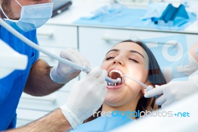 Cute Young Woman At The Dentist. Mouth Checkup Stock Photo