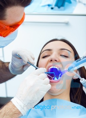 Cute Young Woman At The Dentist. Mouth Checkup Stock Photo