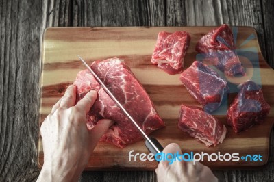 Cutting Angus Beef On The Wooden Table Horizontal Stock Photo