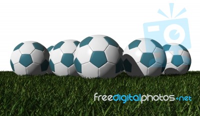 Cyan Soccer Balls On A Green Grass Stock Image