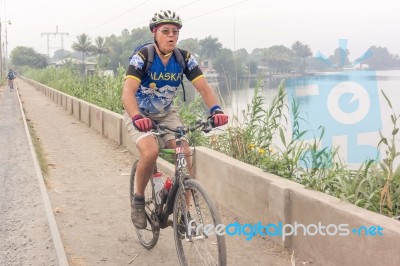 Cyclist Crossing Lake Called Lago De Amatitlan In Villa Canales,… Stock Photo