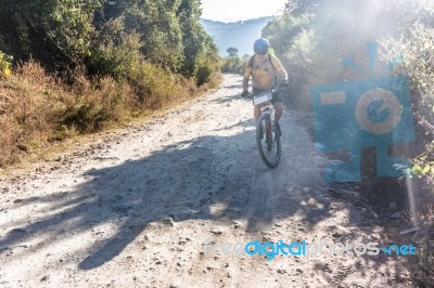 Cyclist On A Dirt Road In Guatemala Highlands Stock Photo