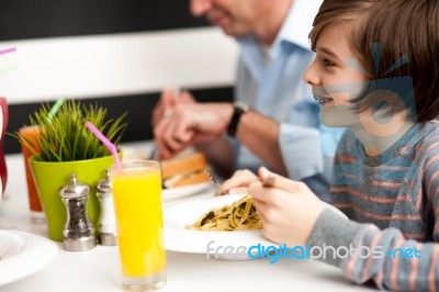 Dad And Son In Restaurant Stock Photo