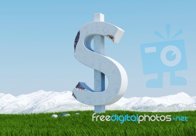 Damaged Concrete Dollar Sign Statue Isolated On Grass Meadow With Snowy Mountain And Blue Sky As Background Stock Image