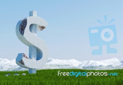 Damaged Concrete Dollar Sign Statue Isolated On Grass Meadow With Snowy Mountain And Blue Sky As Background Stock Image