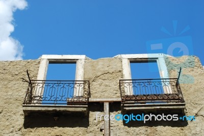 Damaged Facade Building (sky Background) Stock Photo