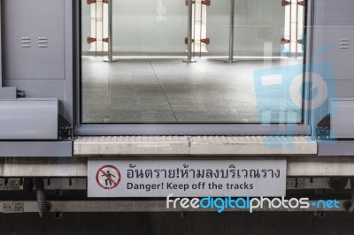 Danger Sign With Closing Door In The Train Station Stock Photo