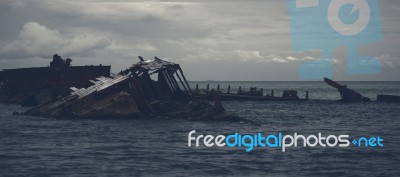 Dark And Gloomy Effect On The Shipwrecks At Tangalooma Island Stock Photo