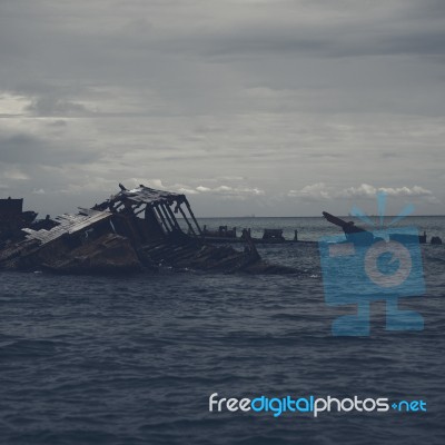 Dark And Gloomy Effect On The Shipwrecks At Tangalooma Island Stock Photo