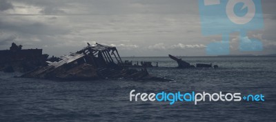 Dark And Gloomy Effect On The Shipwrecks At Tangalooma Island Stock Photo