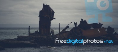 Dark And Gloomy Effect On The Shipwrecks At Tangalooma Island Stock Photo