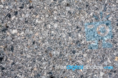 Dark Asphalt With Gravel Texture Stock Photo