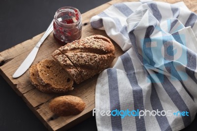 Dark Multigrain Bread Whole Grain And Jam Fresh Baked On Rustic Stock Photo