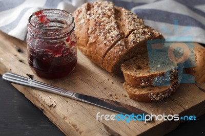 Dark Multigrain Bread Whole Grain And Jam Fresh Baked On Rustic Closeup Stock Photo