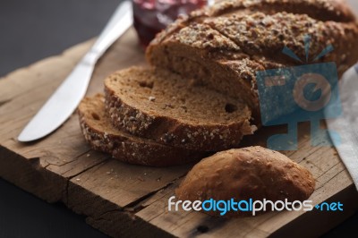 Dark Multigrain Bread Whole Grain And Jam Fresh Baked On Rustic Closeup Stock Photo