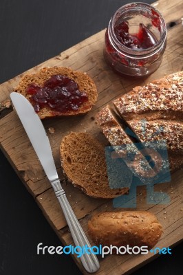 Dark Multigrain Bread Whole Grain And Jam Fresh Baked On Rustic Closeup Stock Photo