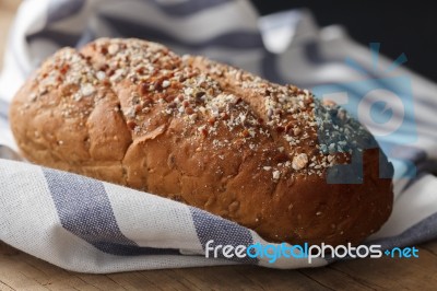 Dark Multigrain Bread Whole Grain Fresh Baked On Rustic Closeup Stock Photo