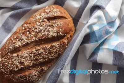 Dark Multigrain Bread Whole Grain Fresh Baked On Rustic Closeup Stock Photo