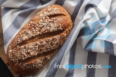 Dark Multigrain Bread Whole Grain Fresh Baked On Rustic Closeup Stock Photo