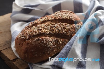 Dark Multigrain Bread Whole Grain Fresh Baked On Rustic Closeup Stock Photo