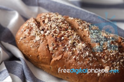 Dark Multigrain Bread Whole Grain Fresh Baked On Rustic Closeup Stock Photo