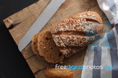 Dark Multigrain Bread Whole Grain Fresh Baked On Rustic Closeup Stock Photo