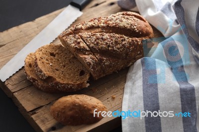 Dark Multigrain Bread Whole Grain Fresh Baked On Rustic Closeup Stock Photo