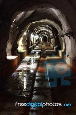 Dark Tunnel With Light Stock Photo