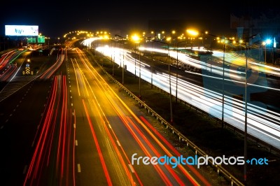 Darknight Traffic Light Trails On Street Stock Photo