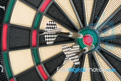 Dartboard And Two Arrows Stock Photo