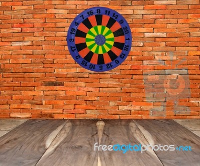 Dartboard On Brickwall Stock Photo