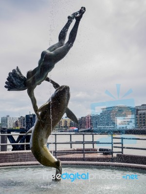 David Wayne Sculpture Girl With The Dolphin Next To Tower Bridge… Stock Photo