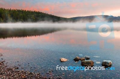 Dawn At Lake Mcdonald Near Apgar Stock Photo