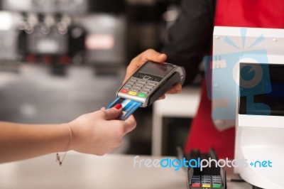 Debit Card Swiping On Card-reader Device Stock Photo