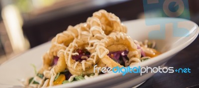 Deep Fried Calamari Rings And Salad Stock Photo