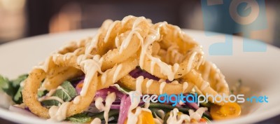 Deep Fried Calamari Rings And Salad Stock Photo