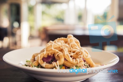 Deep Fried Calamari Rings And Salad Stock Photo