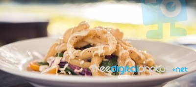 Deep Fried Calamari Rings And Salad Stock Photo