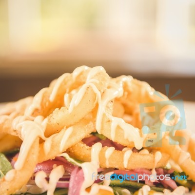 Deep Fried Calamari Rings And Salad Stock Photo