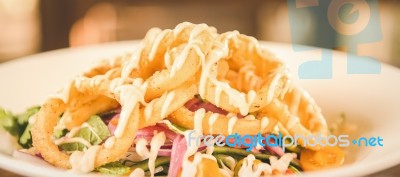 Deep Fried Calamari Rings And Salad Stock Photo