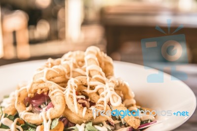 Deep Fried Calamari Rings And Salad Stock Photo