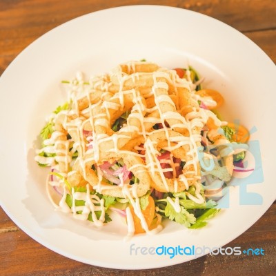 Deep Fried Calamari Rings And Salad Stock Photo