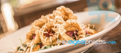 Deep Fried Calamari Rings And Salad Stock Photo