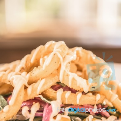 Deep Fried Calamari Rings And Salad Stock Photo