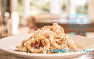 Deep Fried Calamari Rings And Salad Stock Photo