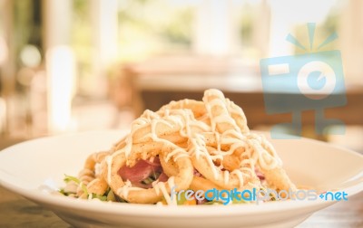 Deep Fried Calamari Rings And Salad Stock Photo